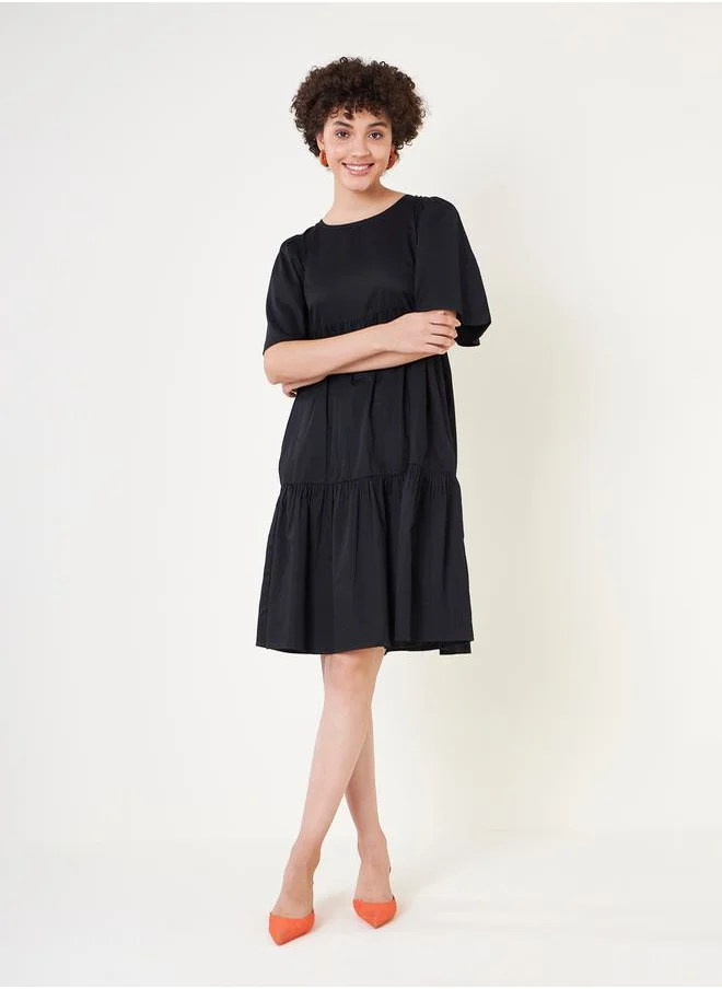 FEMELLA Cotton Tie-Up Back Tiered Midi Dress by Styli