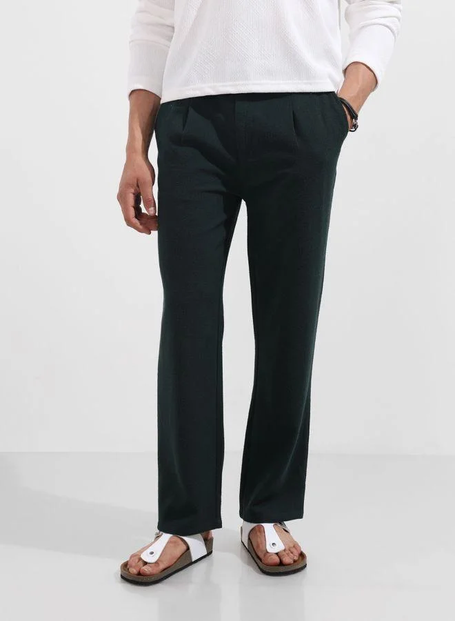 شركة المرآب الهندية Men Relaxed Fit Textured Side Pocket Mid-Rise Trousers