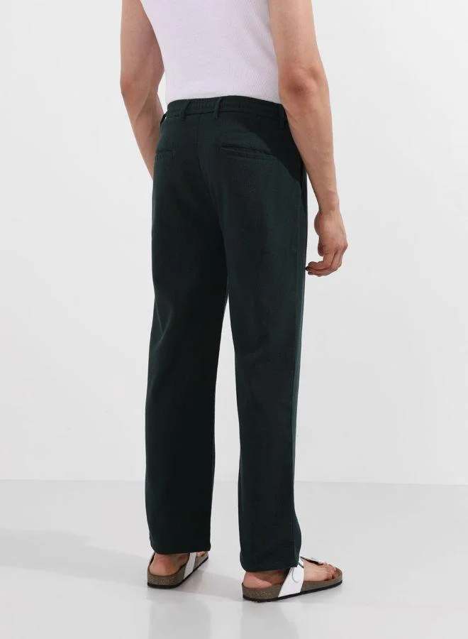 شركة المرآب الهندية Men Relaxed Fit Textured Side Pocket Mid-Rise Trousers