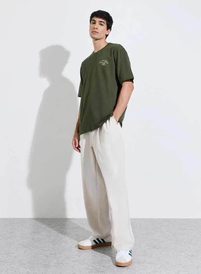 Styli Olive Green Graphic Print Crew Neck Oversized T-Shirt