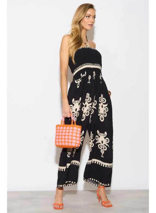 Hoxton Gal Black Printed Jumpsuit – Strapless Tie‑Neck, Shirred Bodice & Wide Legs