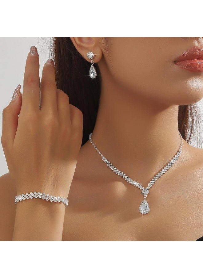 طقم نسائي فضي 4 قطع | عقد وقرط وسوار بحجر الراينستون بتصميم قطرة لفساتين السهرة والملابس ذات العنق V - Image 1