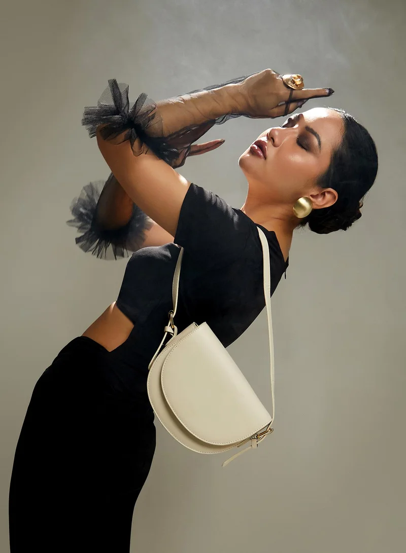 Haute Sauce Haute Sauce Women's Urban Curve Sling Bag For Casual Wear | Ivory White Colour | One-Size| Magnetic Closure | Vegan Leather Material | Detachable Sling | Handbag For Woman & Girls