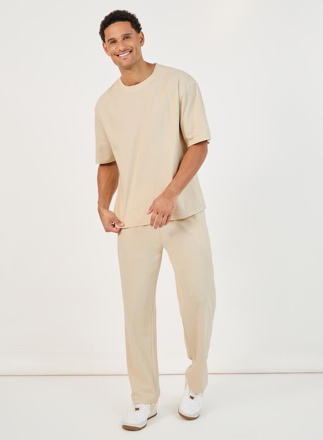 Styli Back Print Oversized T-Shirt & Open Hem Interlock Joggers Co-Ords  - Image 3