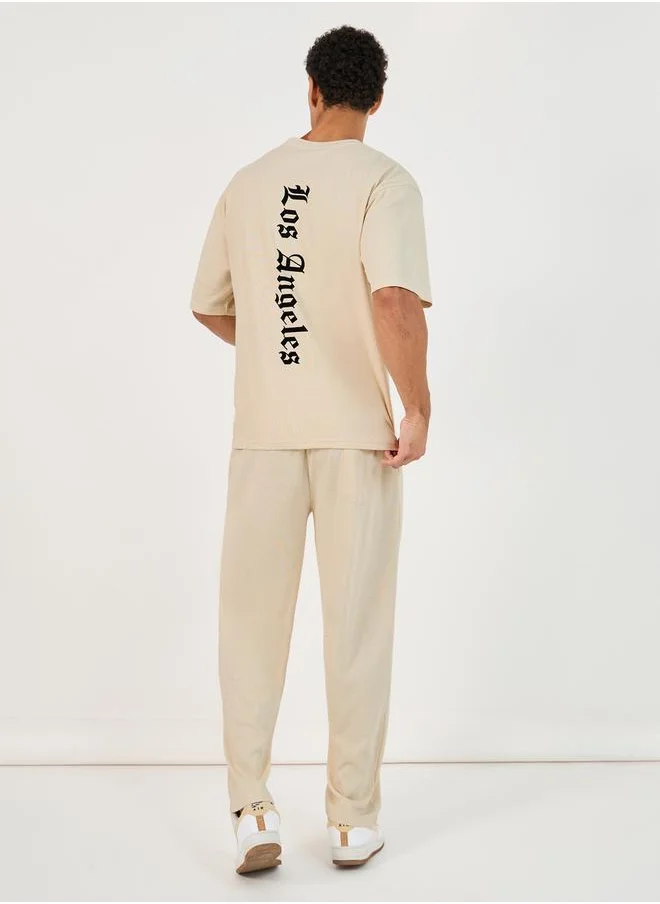 Styli Back Print Oversized T-Shirt & Open Hem Interlock Joggers Co-Ords