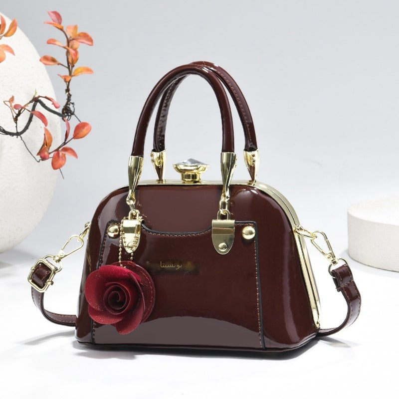 Steel armor mini shell bag, suitable for casual fashion, shiny surface, equipped with floral charm pendant, multi-functional handbag or cross-body bag, fashionable classic, lightweight and durable design