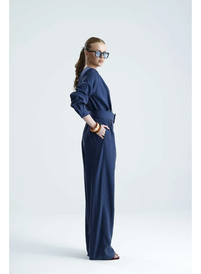GACACOLLECTION ADARA Belted Indigo Cross-Collar Jumpsuit.