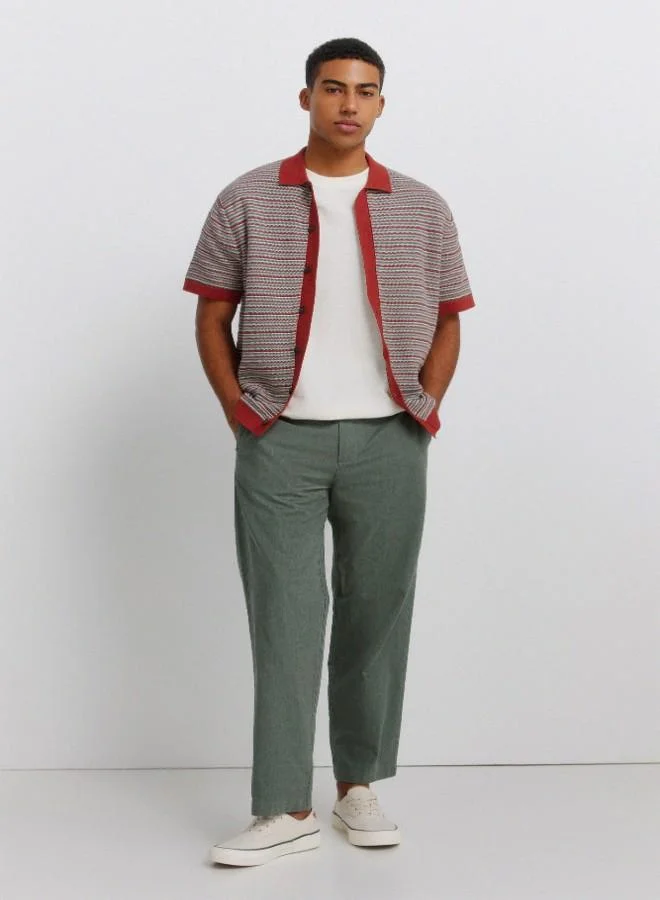 Springfield Linen/cotton trousers with side seam pockets. It has an elasticated waistband at the back and an internal drawstring for a better fit. Back welt pockets. Straight fit.