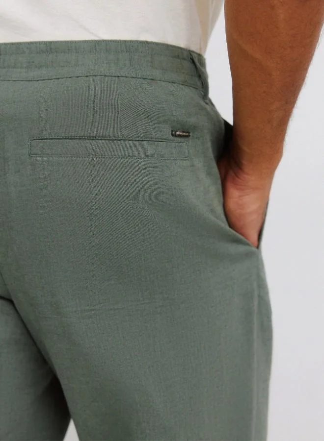 Springfield  Linen/cotton trousers with side seam pockets. It has an elasticated waistband at the back and an internal drawstring for a better fit. Back welt pockets. Straight fit. for Men | Best Price UAE