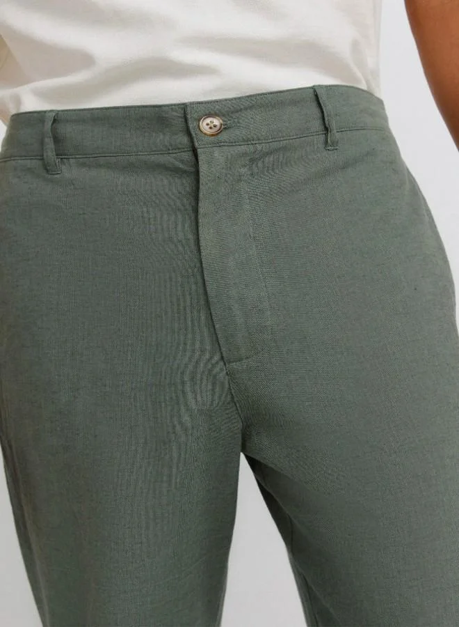 Springfield  Linen/cotton trousers with side seam pockets. It has an elasticated waistband at the back and an internal drawstring for a better fit. Back welt pockets. Straight fit. for Men | Best Price UAE