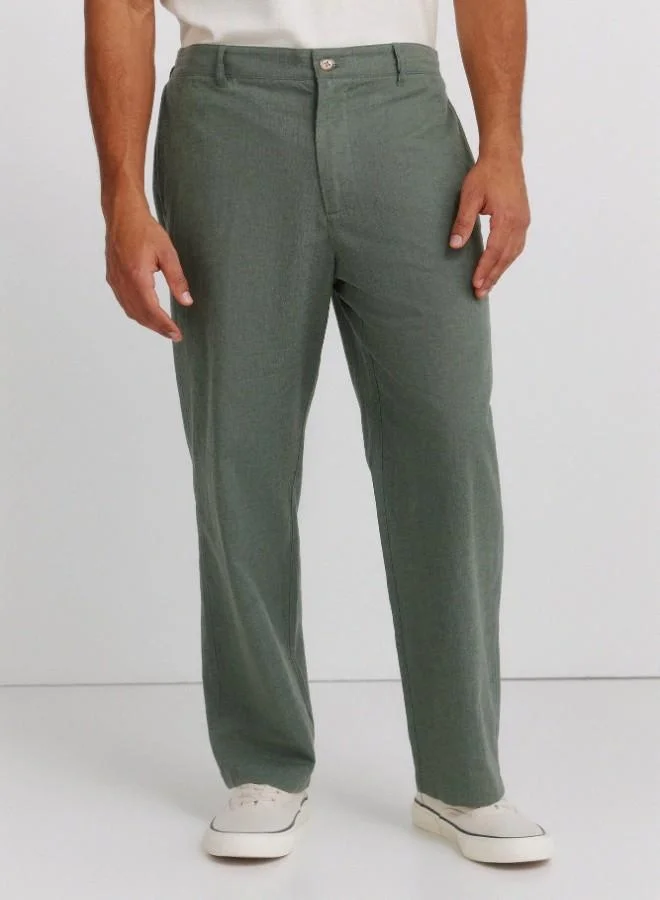 Springfield  Linen/cotton trousers with side seam pockets. It has an elasticated waistband at the back and an internal drawstring for a better fit. Back welt pockets. Straight fit. for Men | Best Price UAE