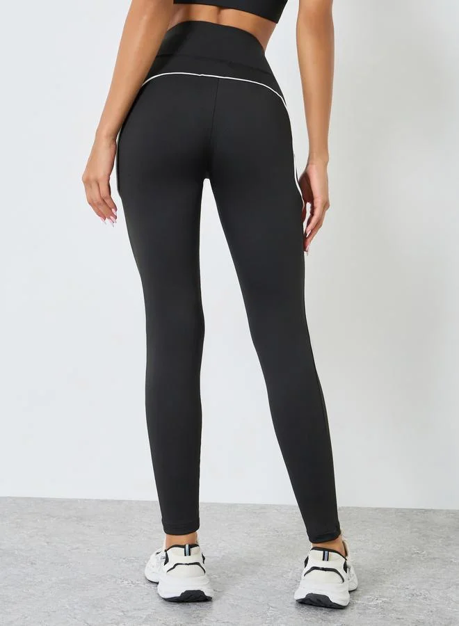 Styli Active  Women Back Reflective Black Leggings for Women | Best Price UAE