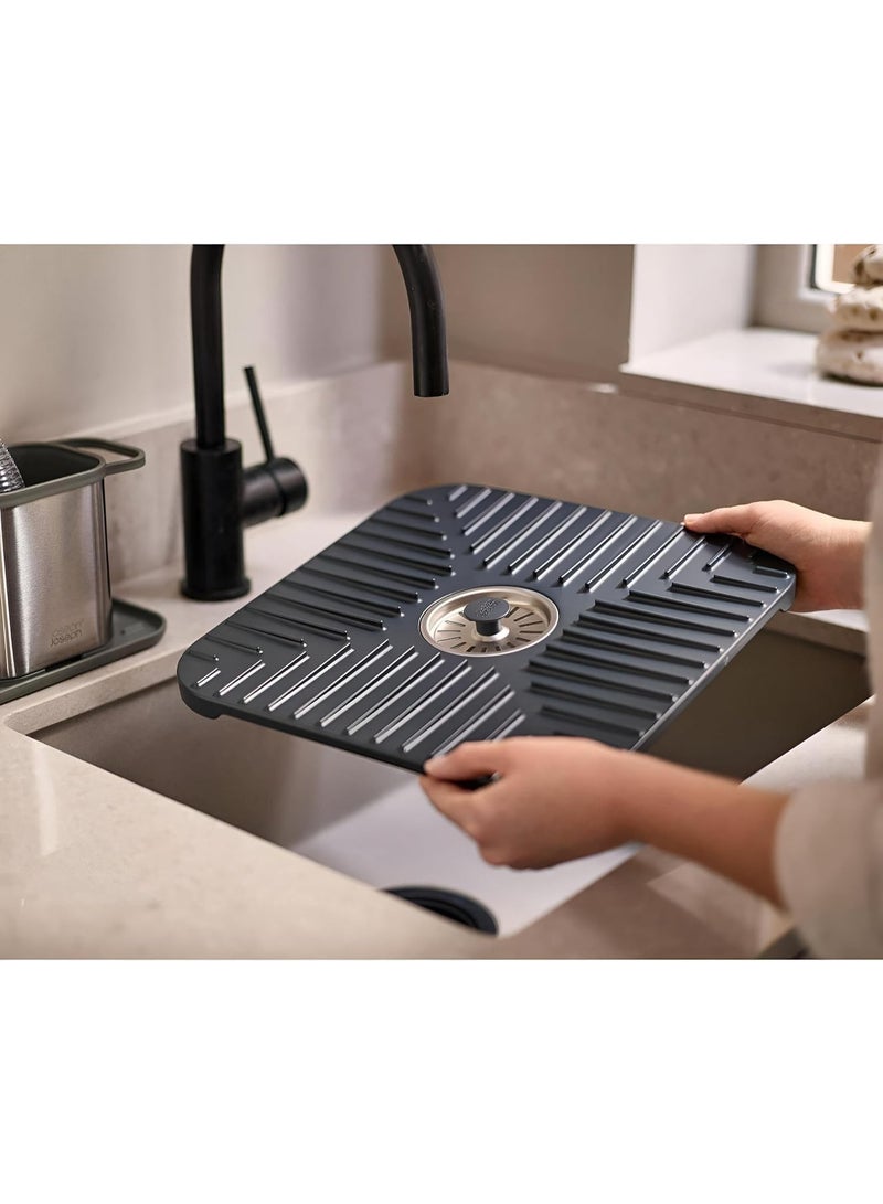 An innovative and versatile sink drainer mat with a non-slip, quick-drying design, suitable for use in the kitchen and bathroom to protect dishes and utensils. - Image 1