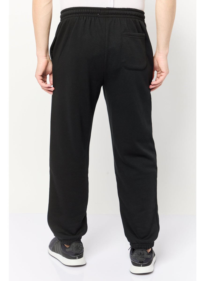 Algspar Men Regular Fit Brand Logo Jogger Pants, Black  - Image 4