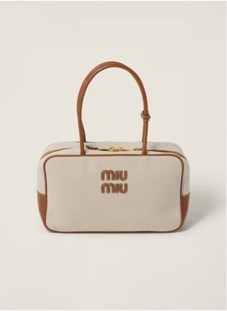Miu Miu Canvas Top-Handle Bag - pzsku/Z84D6C772F6B14991BE2FZ/45/1750145158/2c8786a9-5551-4ea8-a192-4d1b82a2aec3