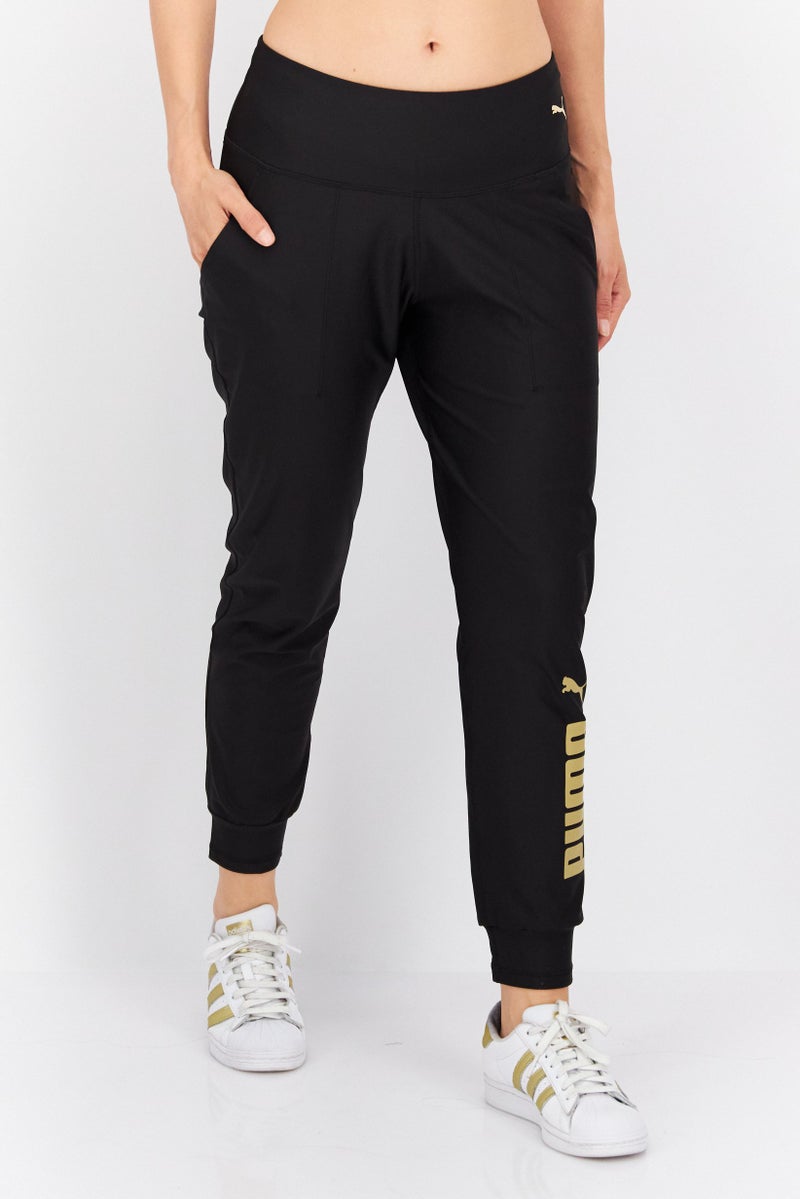 PUMA Women Sportswear Fit Running Track Pant, Black  - Image 1