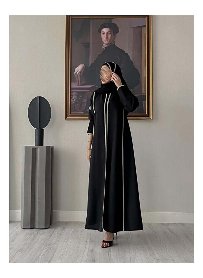 Crater Elegant, modern abaya with a floral pattern on the back. The abaya has a quarter-circle cut and includes a headscarf. - Image 3