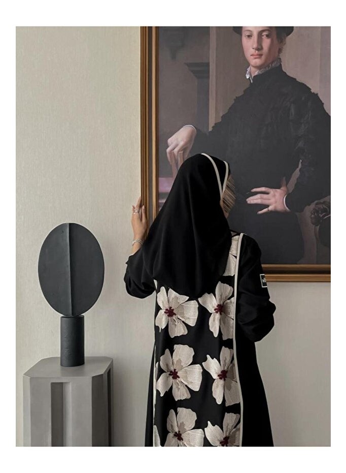 Crater Elegant, modern abaya with a floral pattern on the back. The abaya has a quarter-circle cut and includes a headscarf. - Image 4