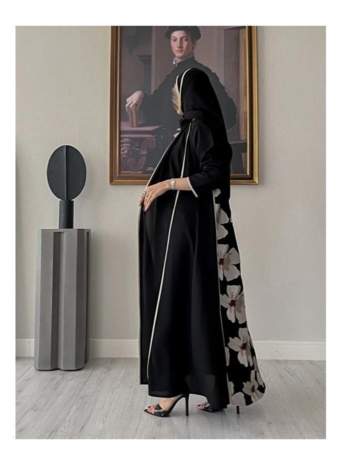 Crater Elegant, modern abaya with a floral pattern on the back. The abaya has a quarter-circle cut and includes a headscarf. - Image 1