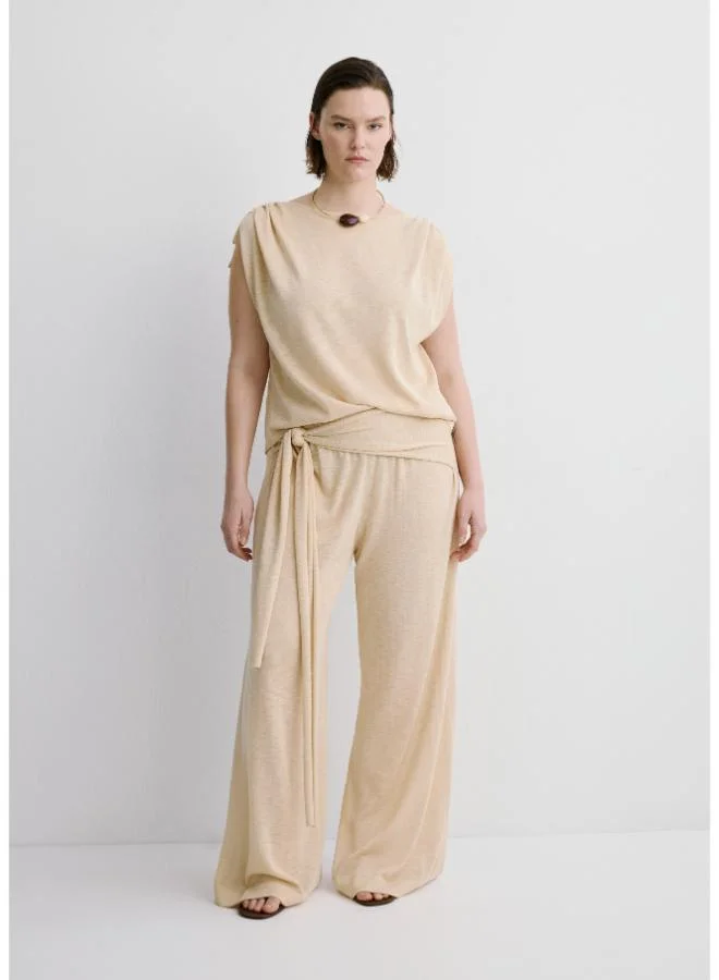 مانجو Fine knit trousers with knot detail