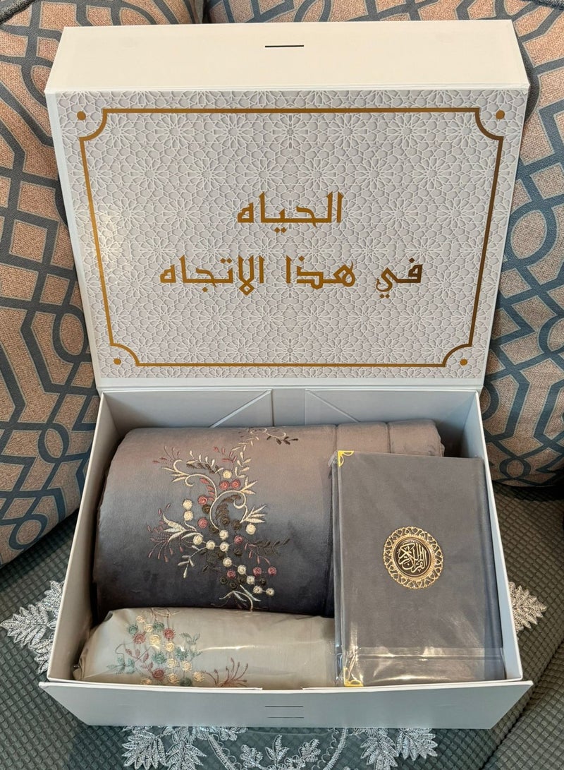 A prayer rug set consisting of 3 pieces, a quilted prayer rug + an embroidered prayer sheet + a Qur’an
