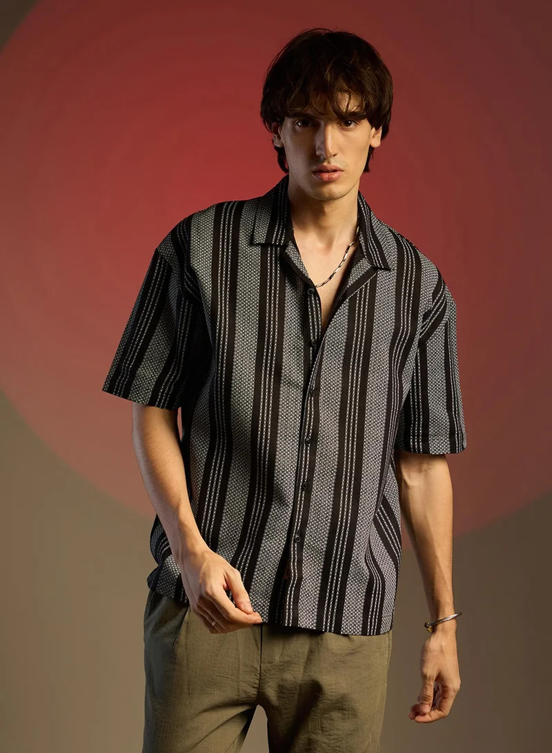 Campus Sutra Campus Sutra Men's Obsidian Black Woven Striped Oversized Shirt For Casual Wear | Cuban Collar | Short Sleeve | Button Closure | Oversized Shirt Crafted With Comfort Fit For Everyday Wear