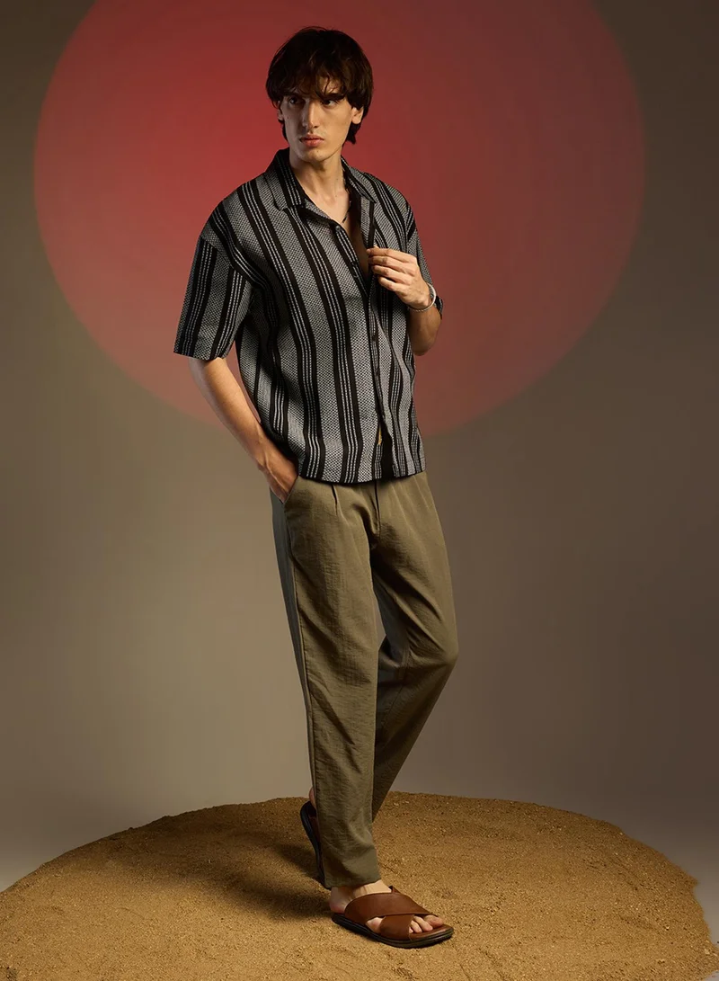 Campus Sutra Campus Sutra Men's Obsidian Black Woven Striped Oversized Shirt For Casual Wear | Cuban Collar | Short Sleeve | Button Closure | Oversized Shirt Crafted With Comfort Fit For Everyday Wear