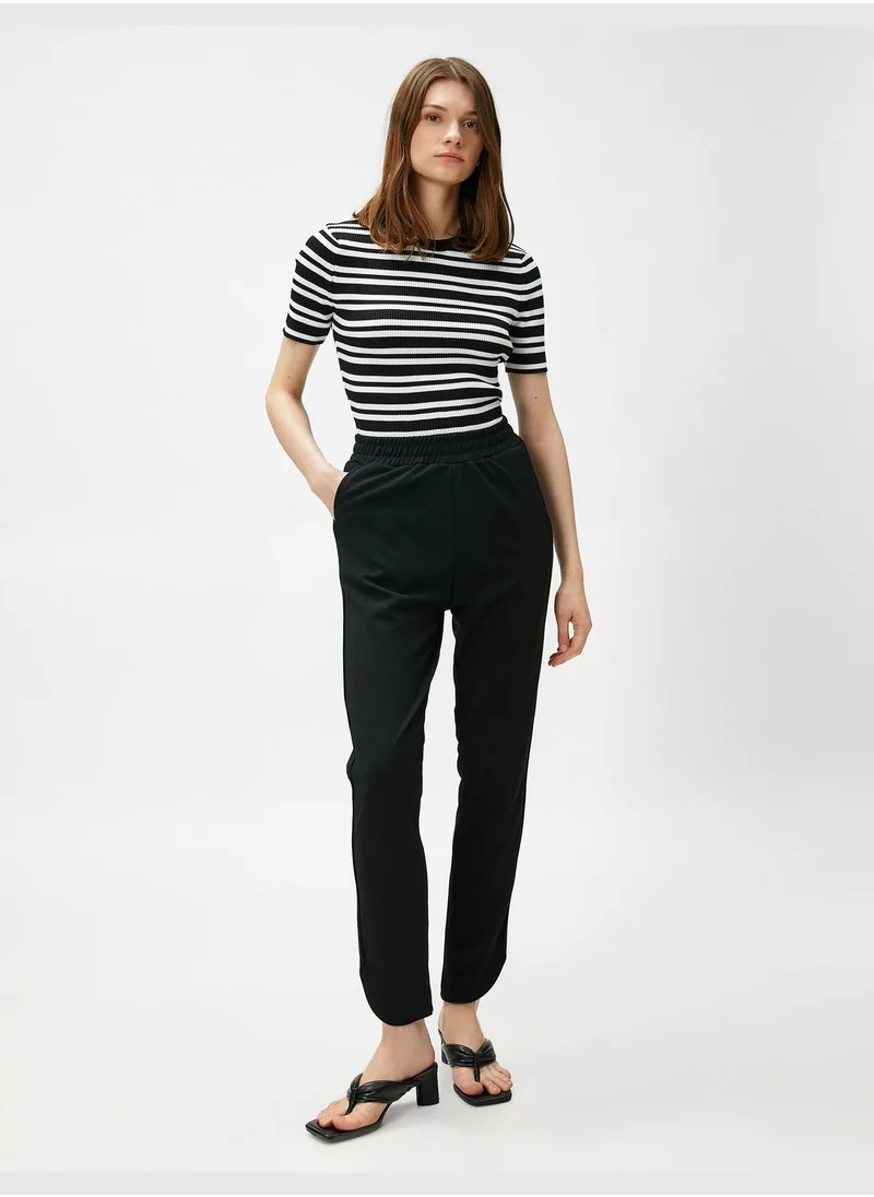 KOTON Elastic Waist Slim Leg Slitted Trousers