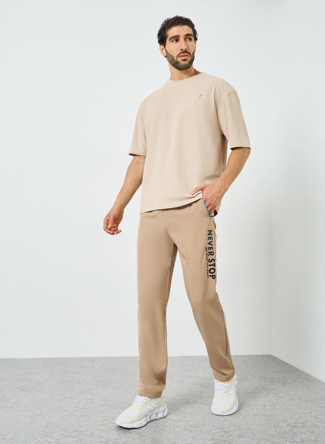 Styli Active Men Beige Graphic Training Track Pants - Image 2