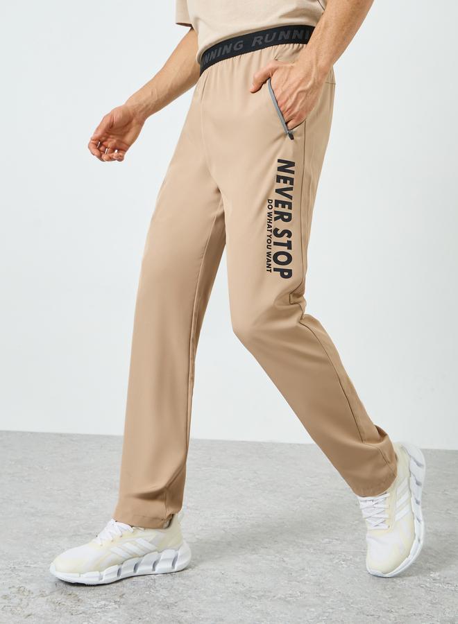 Styli Active Men Beige Graphic Training Track Pants - Image 1