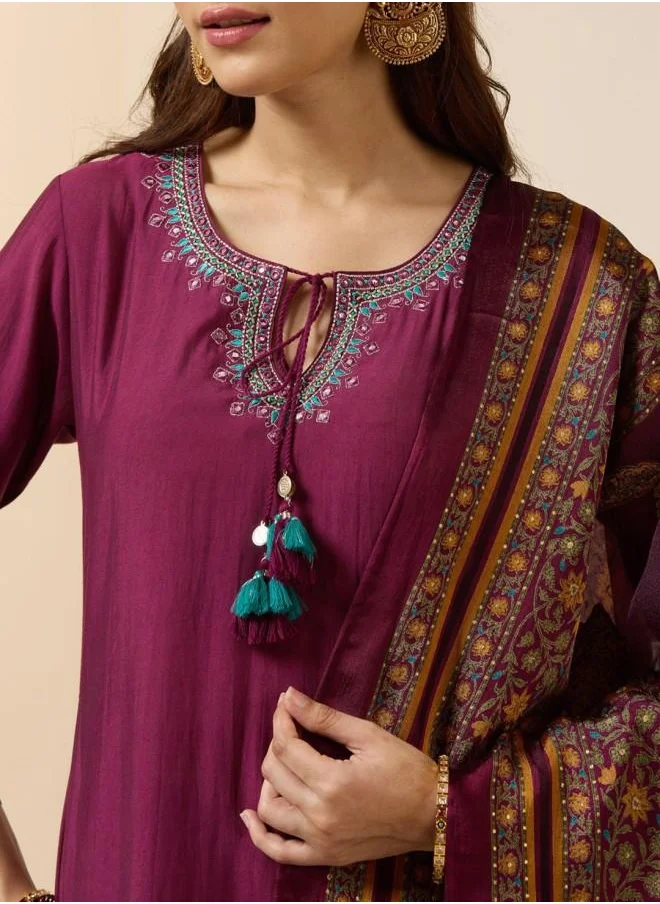 ISHIN Three-Fourth Sleeve Women Purple Poly silk Kurta Set with Embroidered pattern Tunic and Palazzo features a Round neckline and Three-Fourth Sleeve secured with Elastic closure and styled in Straight Fit ideal for Festive moments — exude elegance in every glance.