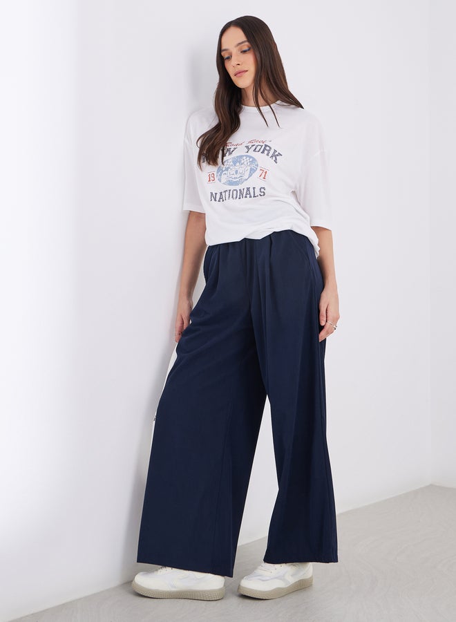 ستايلي سراويل نسائية واسعة الساق من الكوردروي باللون الكحلي - Image 1