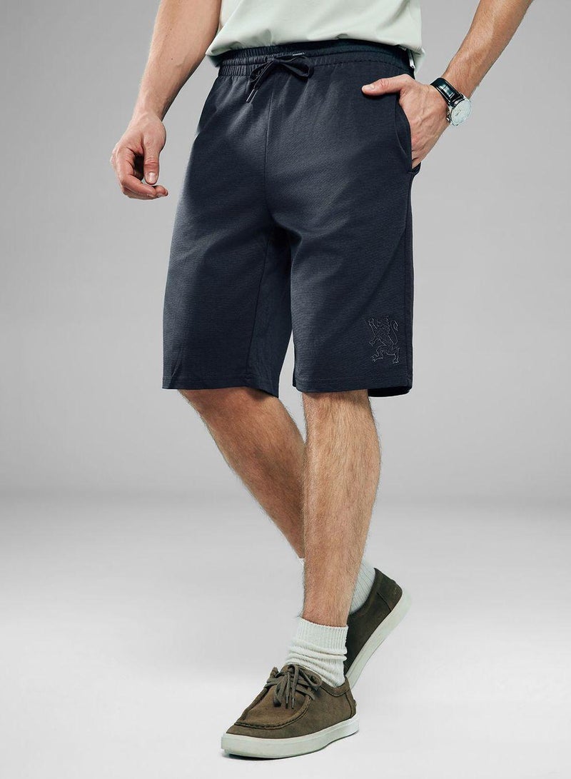 GIORDANO Men Regular Interlock Embroidery Shorts - Image 1