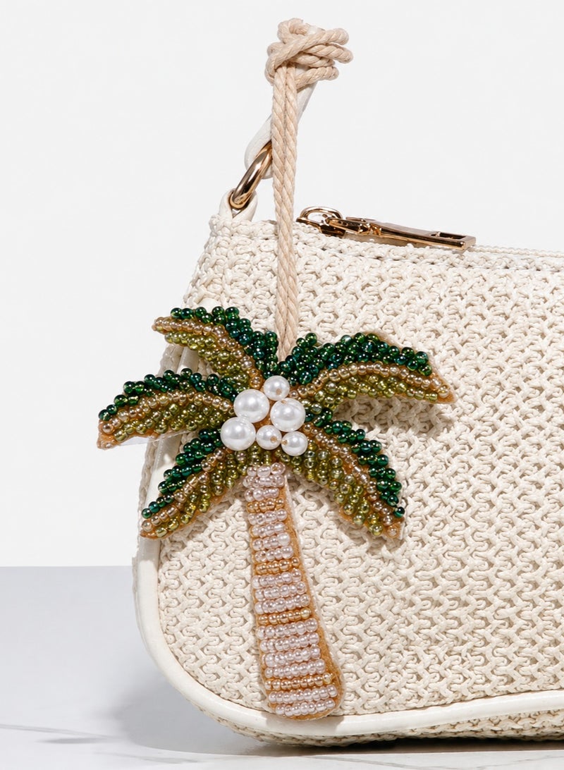 Saudi National Day Decoration – Palm Tree Bag Charm
A beautifully crafted bag charm featuring a palm tree design, made with delicate, shiny, and colorful beads. It adds a unique touch to your keys or bag and comes with a wrist strap for easy carrying and everyday use.
Can be used as a keychain or bag accessory.
Perfect for Saudi National Day celebrations and decorations. - Image 1
