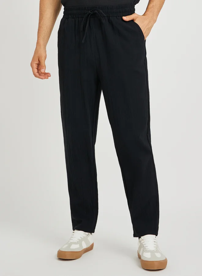 ستايلي Styli Men Black Solid Drawstring Waist Pocket Detail Relaxed Fit Pants
