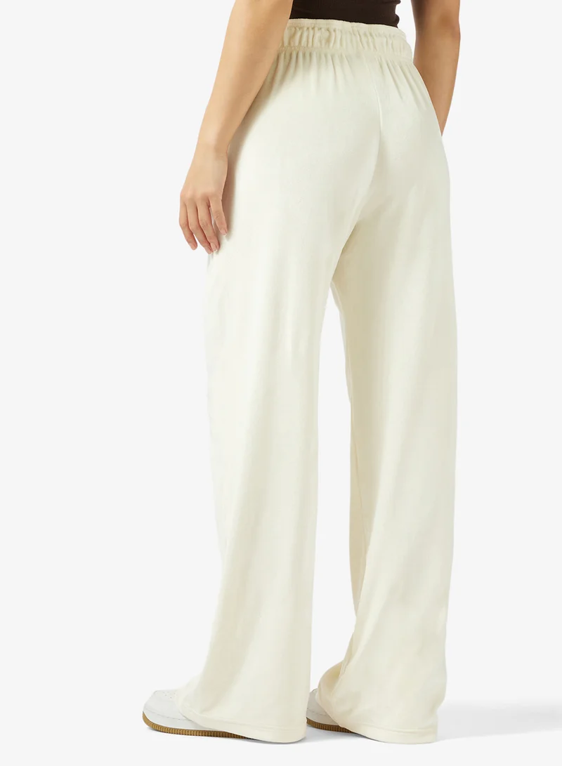 Nike  Nsw Trend Velour Pixel High-Rise Wide Sweatpants for Women | Best Price UAE