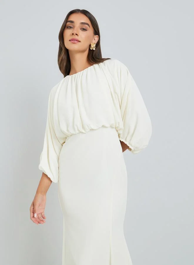 ستايلي فستان طويل بحافة حورية البحر لون كريمي