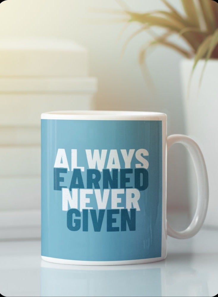 Story Of Candle Ceramic mug with the “ALWAYS EARNED NEVER GIVED” design printed in white  - Image 1
