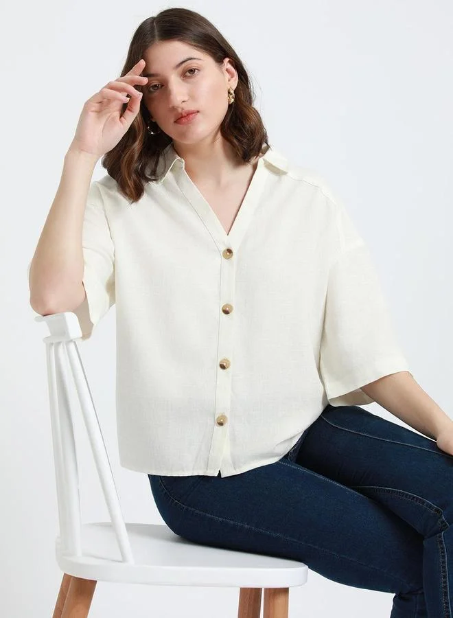 دينيس لينغو بلوزة كاجوال بلون أبيض مائل بقصة مريحة