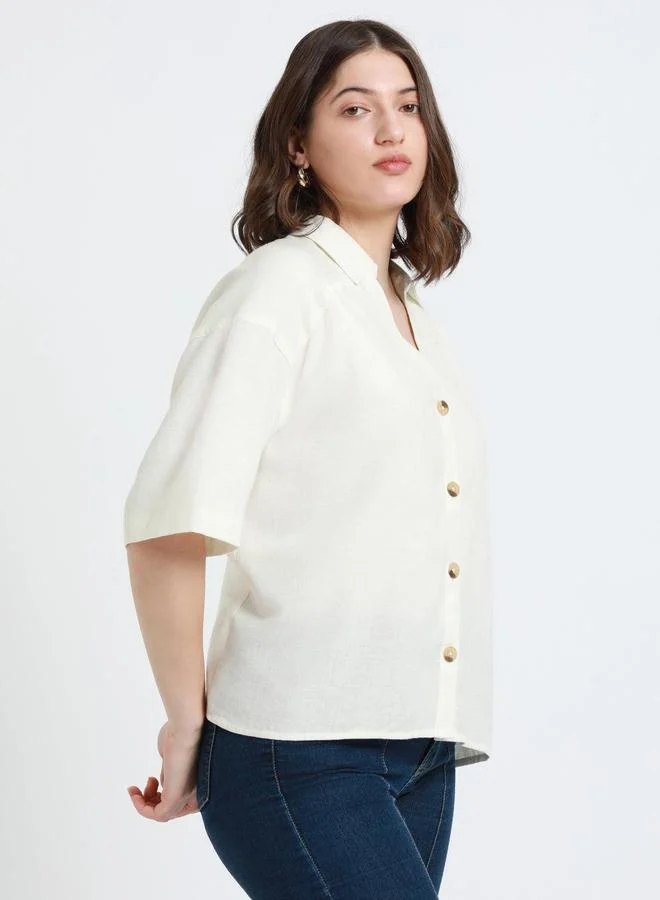 دينيس لينغو بلوزة كاجوال بلون أبيض مائل بقصة مريحة