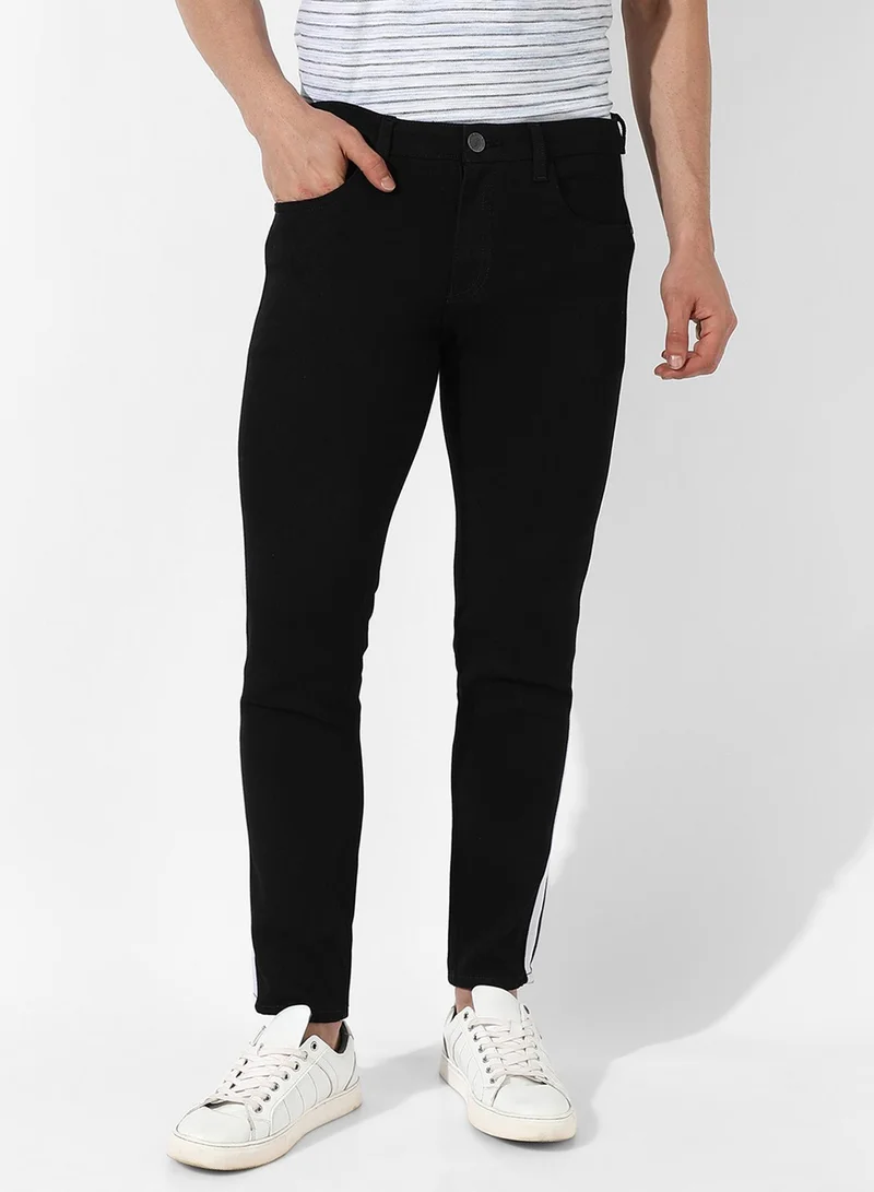 Campus Sutra Men's Black Tapered Side Striped Denim Jeans | Stretchable Cotton Mid-Rise Denim Jeans Crafted With Comfort Fit and High Performance For Everyday Wear