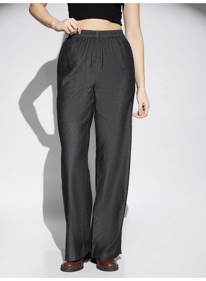 جلو باص بنطلون نسائي واسع الساق بخصر مطاطي أسود من الدنيم