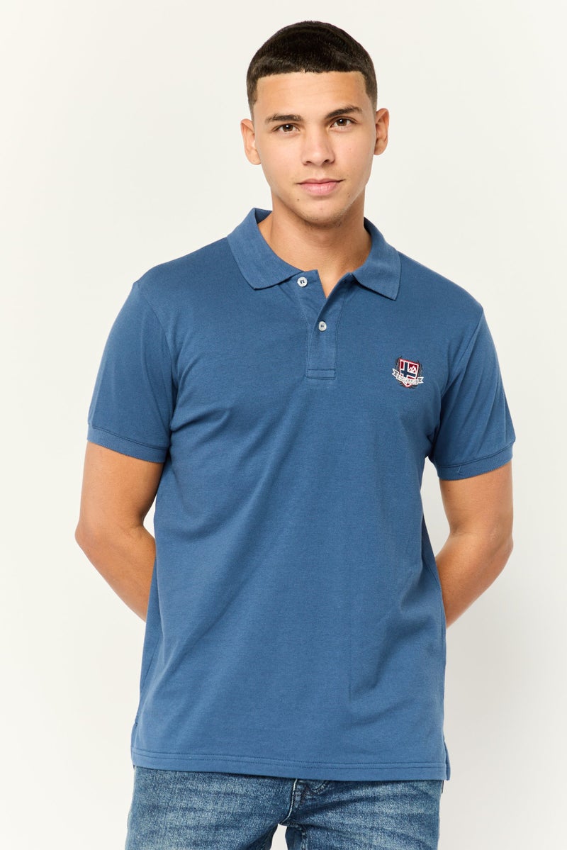 Nordland تي شيرت بولو بأكمام قصيرة بتصميم عادي للرجال بشعار العلامة التجارية، أزرق - Image 1