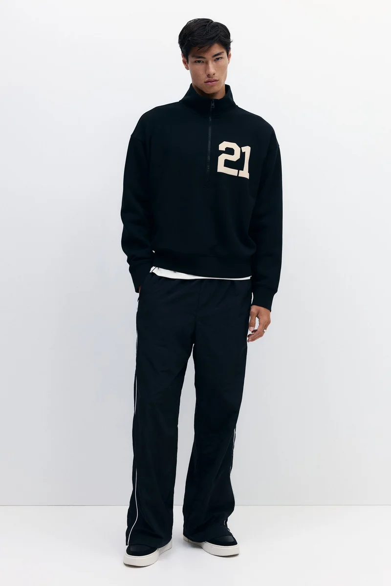 اتش اند ام سويت شيرت بقصّة واسعة مع سحاب