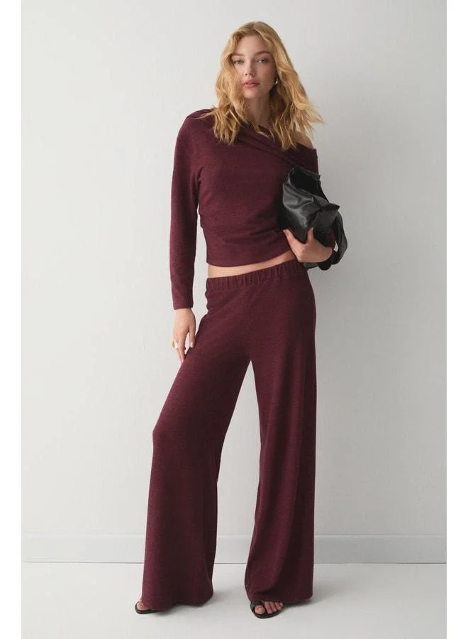 DELORE Women's soft and stretchy fabric asymmetric-collared drape-detailed burgundy top‑bottom set.