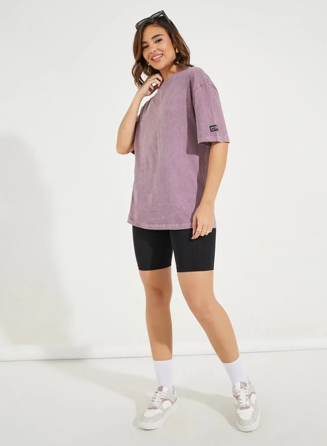 Styli Oversized Longline Acid Wash T-Shirt with Badge Detail