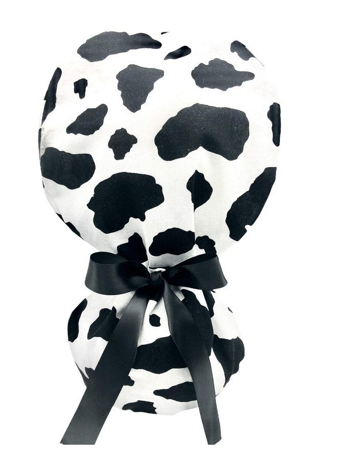 Generic Ponytail Scrub Cap, in a dramatic black and white cow pattern. Select the satin ribbon tie backs from 8 color options. - Image 1