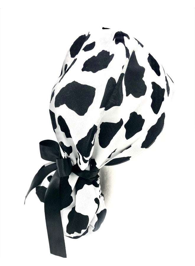 Generic Ponytail Scrub Cap, in a dramatic black and white cow pattern. Select the satin ribbon tie backs from 8 color options. - Image 2