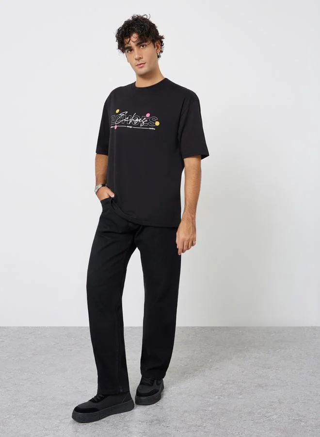 Styli Men Black Oversized Graphic Print Jersey T-Shirt