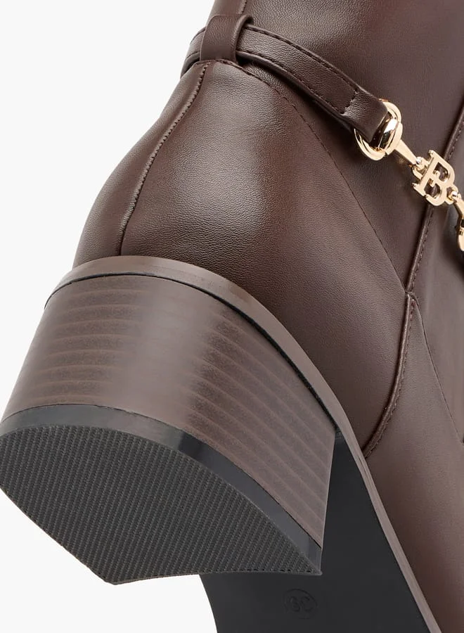 فلورا بيلا من شو إكسبرس Women Metal Accent High Shaft Boots with Block Heels and Zip Closure